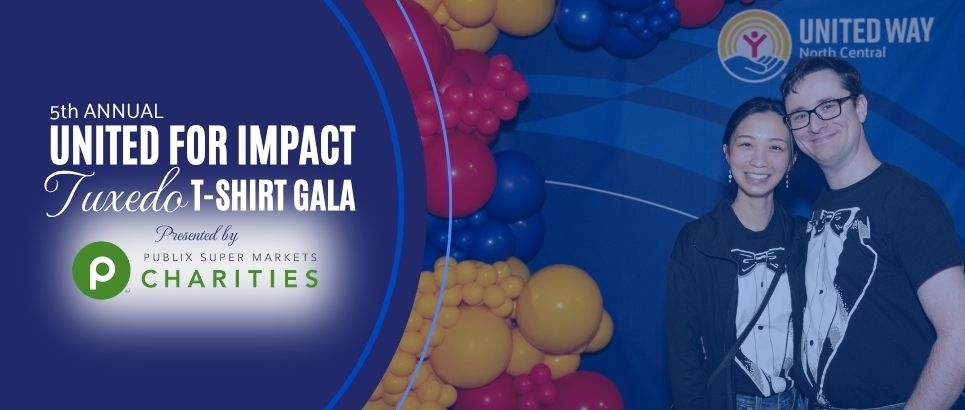 A couple in tuxedo t-shirts stands in front of a blue backdrop framed by red, yellow, and blue balloons. A dark blue circle graphic is overlayed on the left side announcing the 5th annual United for Impact Tuxedo T-shirt Gala presented by Publix Supermarket Charities.