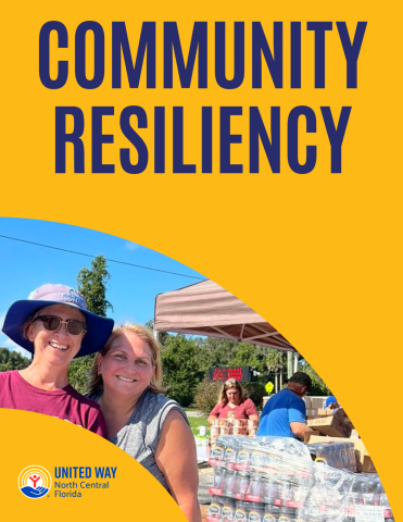 volunteers standing in front of disaster supplies